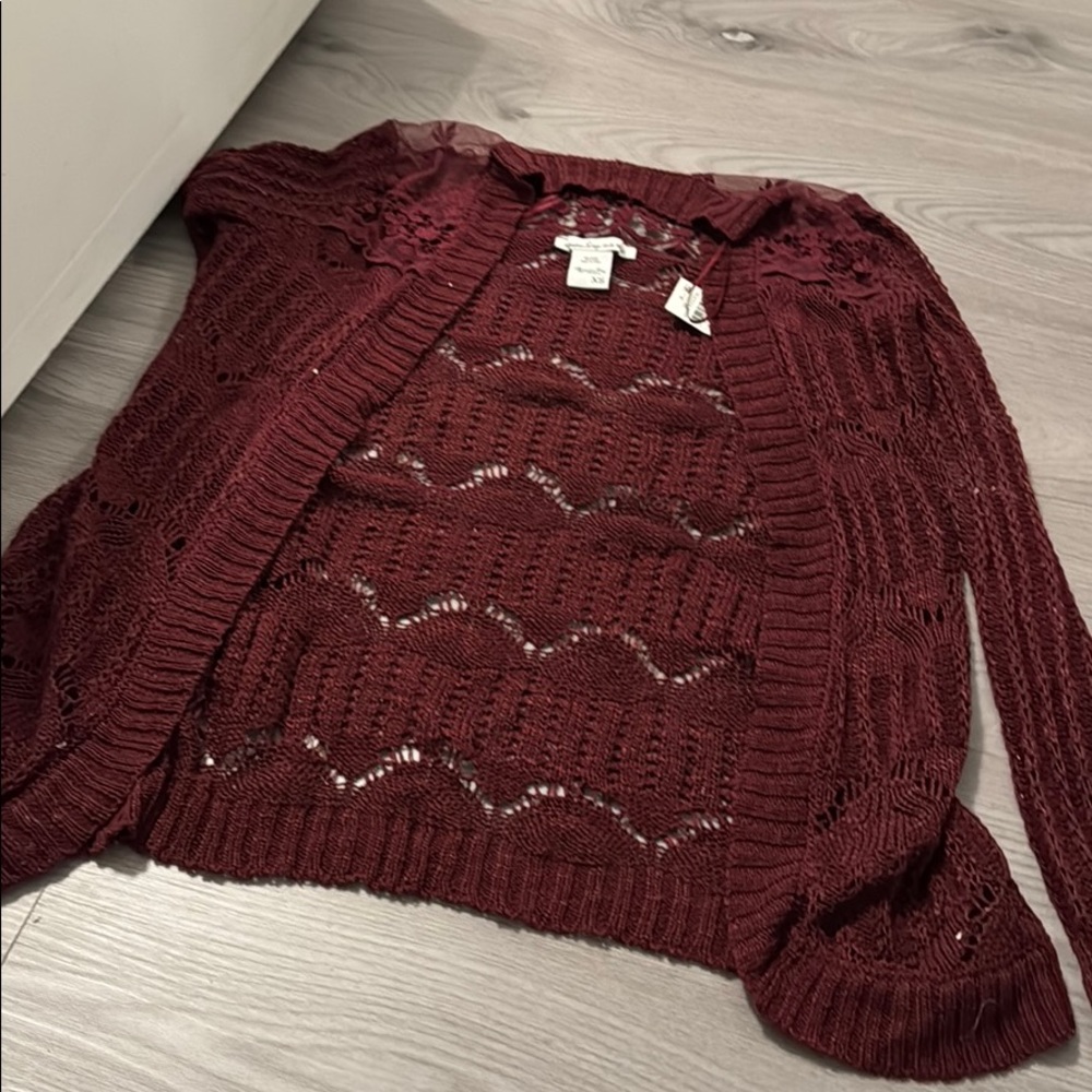 A maroon cardigan